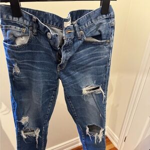 Mousy vintage denim. Great fit. Holes. Taper at bottom slightly boyfriend style